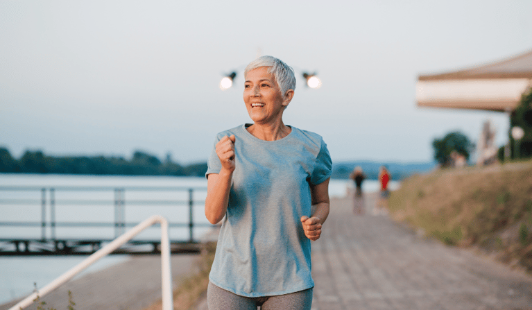 Healthy empowered older woman out walking.