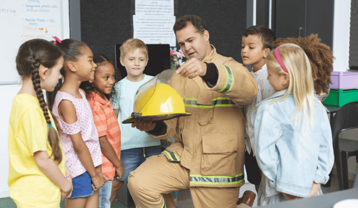 firefighter talking to a classroom of children